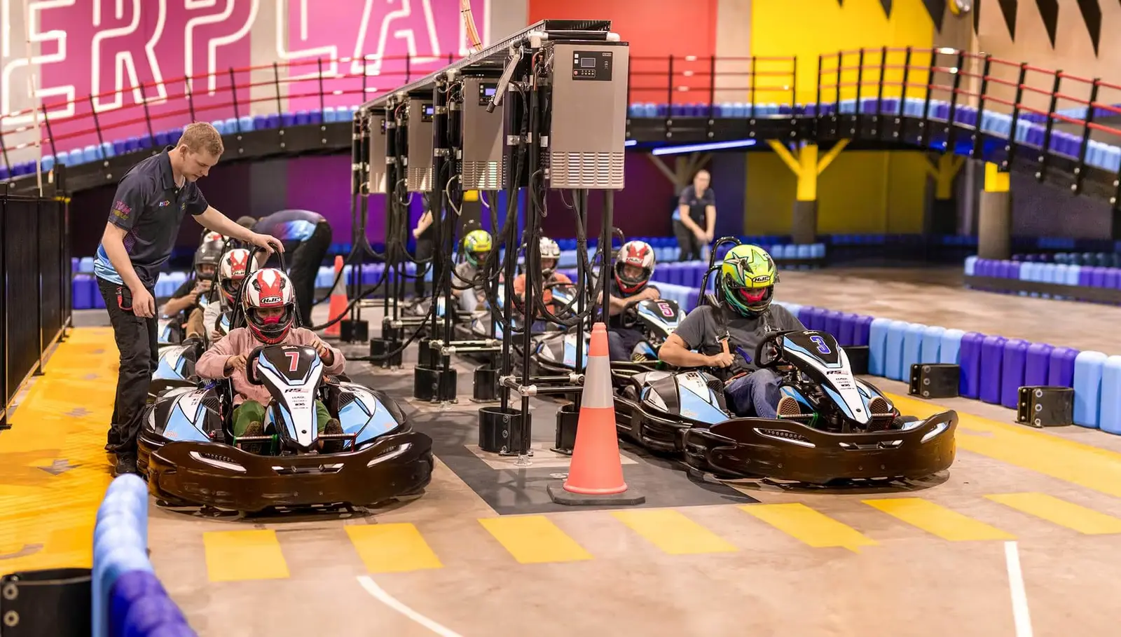 A group of PowerPlay racers getting ready together